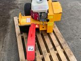 a small machine that is sitting on top of a pallet