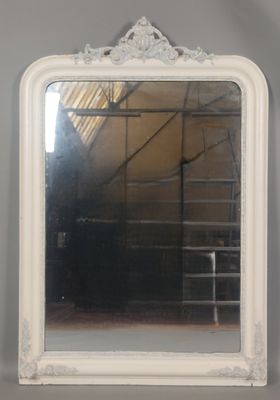 a mirror hanging on the wall in a room