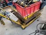 a red box with tools in it sitting on a pallet