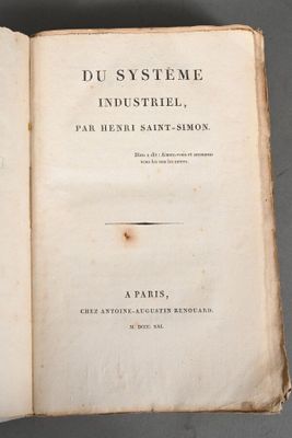 an open book with a picture of an industrial plant on it