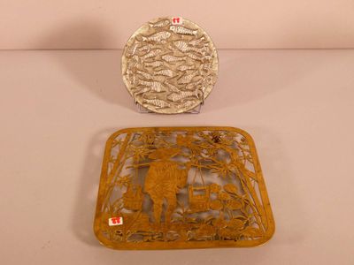 two decorative items that are sitting on a table