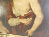 une photo d'un tableau représentant un homme tenant un livre