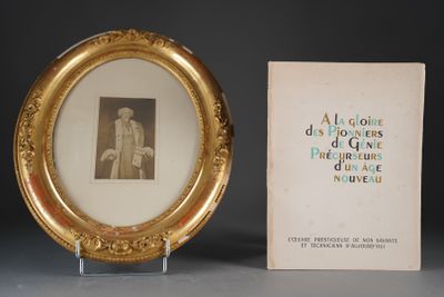 a picture of a picture of a man in a gold frame next to a book