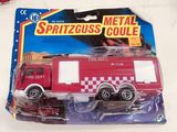 a red fire truck that is in a package