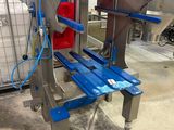 a picture of a machine that is working on a conveyor belt