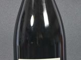 a bottle of wine that is sitting on a table