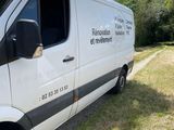 a white van parked on the side of the road
