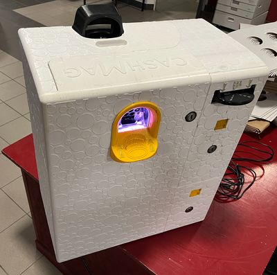 a white refrigerator that is sitting on top of a red table