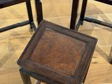 two small tables with a wooden top on a hard wood floor