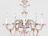 an image of a pink and white chandelier hanging from a ceiling