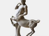 an image of a statue of a man riding on a horse