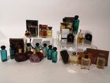 many different types of perfumes on display on a table