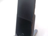 a cell phone that is sitting on a stand