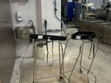 two stools that are sitting next to each other in a room