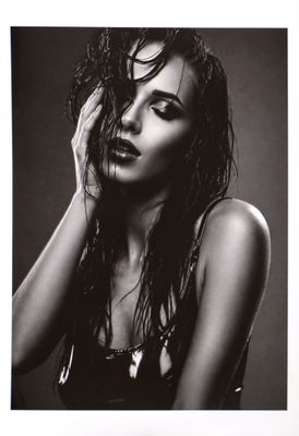black and white photograph of a woman with wet hair posing for a picture