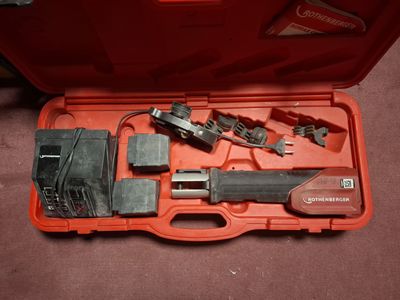 a tool in a case that is sitting on the floor