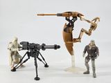 three action figures that are standing next to each other