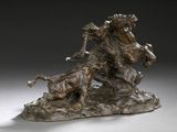 sculpture en bronze représentant un homme à cheval sur un rocher