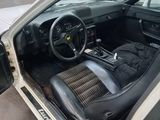 an image of a car in a garage with its door open