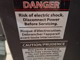 a danger sign on the back of a machine