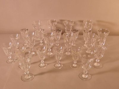 a lot of wine glasses sitting on a table