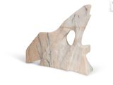 a marble sculpture of a shark on a white background