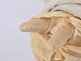 a stuffed animal that is wrapped in a blanket