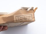 a person holding a piece of paper that has been torn off