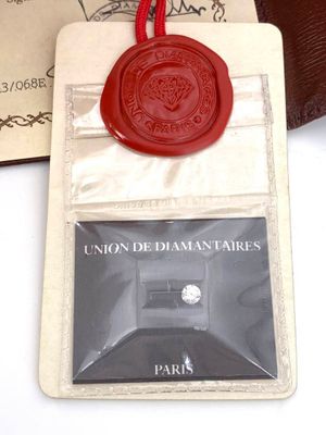 a red wax seal on top of a card holder