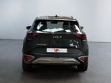 the rear end of a black suv parked in a showroom