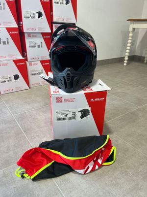 a helmet sitting on top of a box on the floor