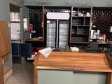 a kitchen with a wooden counter and refrigerator in it