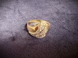 a picture of a gold ring with diamonds on it