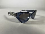 a close up of a pair of sunglasses on a white surface
