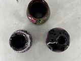 three vases that are sitting on a table