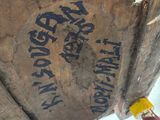 a large wooden barrel sitting on a wooden stand
