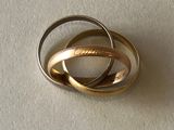 two rings that are on top of a white surface