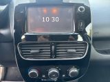 a car dashboard with a digital clock on it