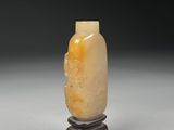 chinese carved yellow jade snuff bottle on stand