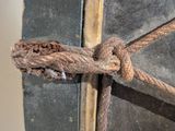 a close up of a piece of luggage with a rope on it
