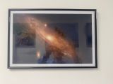 a picture of a picture of a cat and a picture of a galaxy