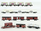 six different types of toy trains on display on a shelf