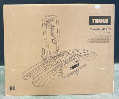 une boîte en carton sur laquelle est collée l'image d'un porte-vélos