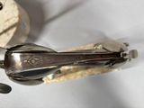 a spoon and a spoon rest on a white table