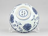 a blue and white vase with flowers and birds on it