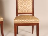 pair of chairs with upholstered back and upholstered seat
