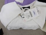 a white shirt and a purple shirt with a tag on it