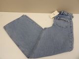 the back of a pair of blue jeans on a white table