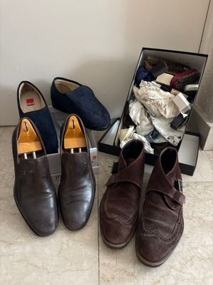 two pairs of shoes sitting next to each other on the floor