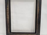 an old wooden picture frame on a white background